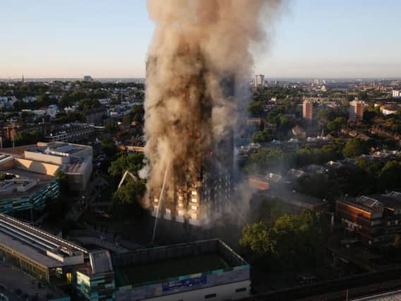 The fire engulfs Grenfell House