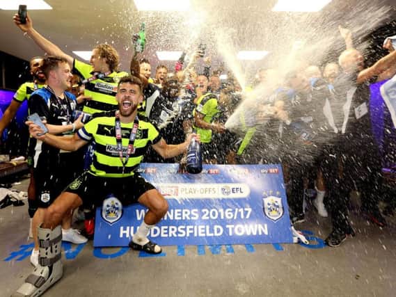 Huddersfield Town celebrate their promotion to the Premier League at Wembley in May