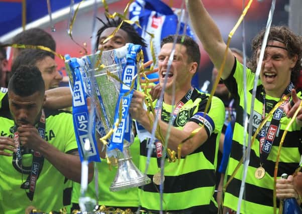 Huddersfield Town's Mark Hudson celebrates with the trophy after winning the Sky Bet Championship play-off final.