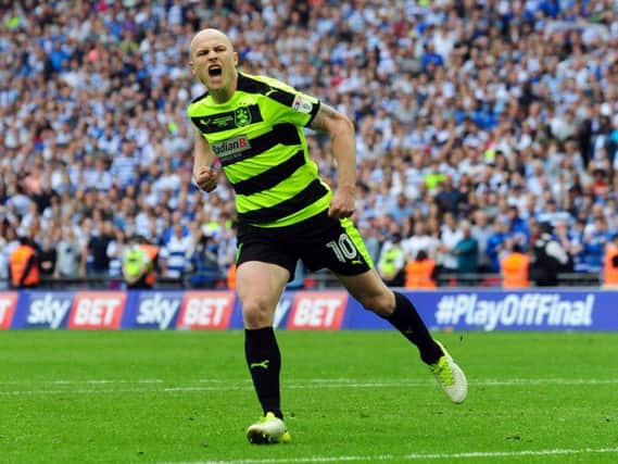 Aaron Mooy was instrumental in guiding Huddersfield Town to the Premier League last season