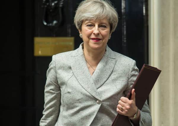 Theresa May remains as Prime Minister, despite losing her Commons majority.