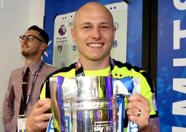 Aaron Mooy celebrates winning the Championship play-off final at Wembley