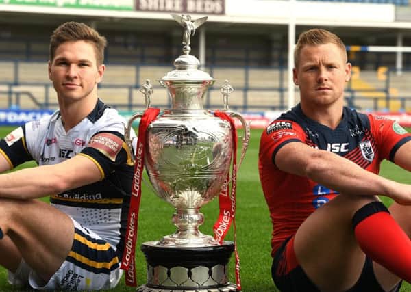 Leeds Rhinos' Matt Parcell and Featherstone Rovers'  Keal Carlile with the Challenge Cup.
Picture Bruce Rollinson