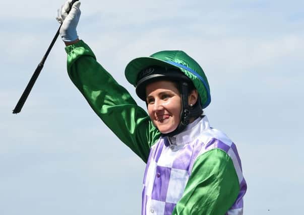 Jockey Michelle Payne celebrates after winning the Melbourne Cup on Prince Of Penzance at Flemington Racecourse. Picture: AP/Andy Brownbill.