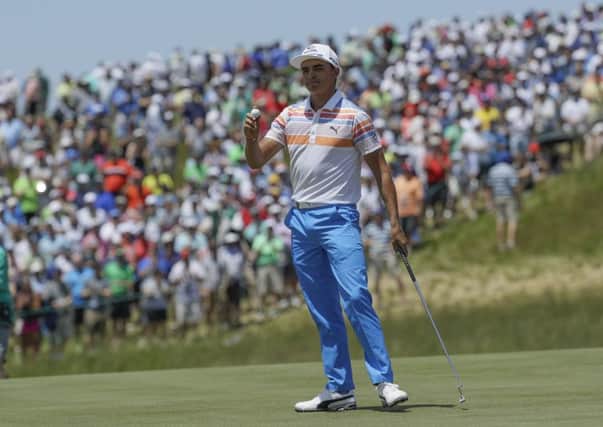 Rickie Fowler acknowledges the crowds applause after one of seven birdies in a boge- free first round of 65 at the US Open (Picture: David J Phillip/AP).