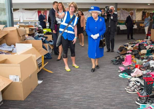 The Queen visits a care centre supporting victims of the Grenfell Tower inferno.