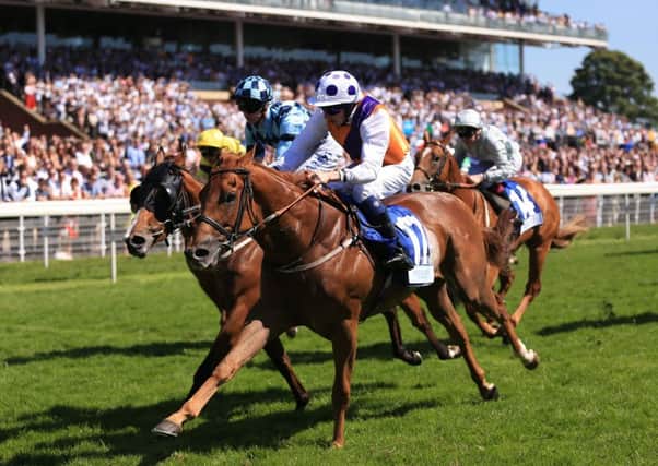 Golden Apollo (centre right) ridden by James Sullivan wins The Catherine Kinloch Paver Memorial Macmillan Charity Stakes at York Racecourse. (Picture: Nigel French/PA Wire)