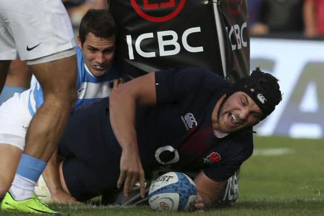 England's Charlie Ewels, right, scores a try during a rugby test match against Argentina in Santa Fe. (AP Photo/Agustin Marcarian)