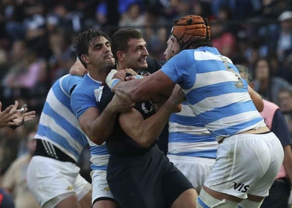 Argentina's Tomas Lavanini, right, fights with England's Jonny May during a rugby test match against Argentina in Santa Fe.(AP Photo/Agustin Marcarian)