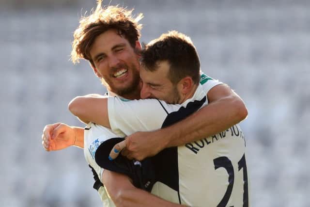 Middlsex's bowler Toby Roland-Jones with Steven Finn (left) celebrates taking the final wicket of Yorkshire's Ryan Sidebottom to win the County Championship