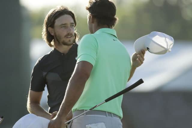 Well done: Brooks Koepka shakes hands with Tommy Fleetwood, left, on the 18th hole .
Picture: AP Photo/Charlie Riedel