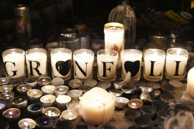 Tributes are left by Latymer Community Church, near to Grenfell Tower in west London after a fire engulfed the 24-storey building last week. Picture: Victoria Jones/PA Wire