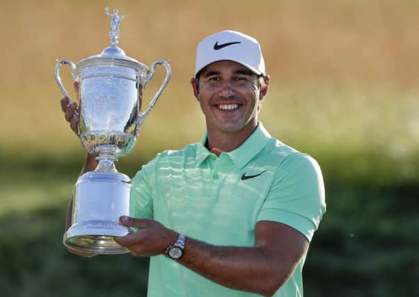 It's mine: Brooks Koepka poses with the trophy after winning the US Open.
Picture: AP Photo/Chris Carlson