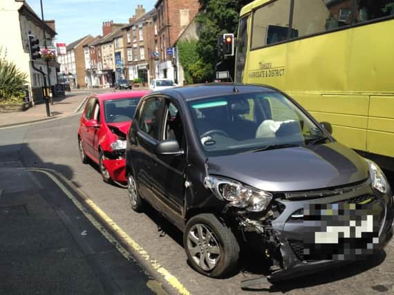 Two vehicles involved are still partially blocking York Place waiting to be recovered. Picture: James Monaghan