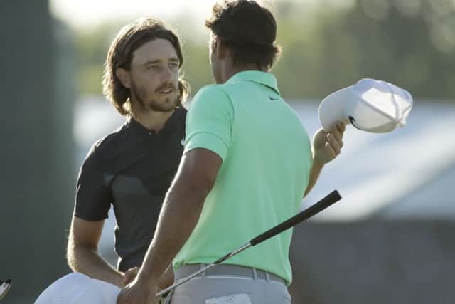 Brooks Koepka shakes hands with Tommy Fleetwood, of England, on the 18th hole during the fourth round of the U.S. Open golf tournament Sunday, June 18, 2017, at Erin Hills. (AP Photo/Charlie Riedel)