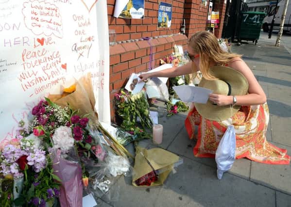 Floral tributes outside a mosque in Finsbury Park where a van ploughed into Muslims leaving evening prayers.