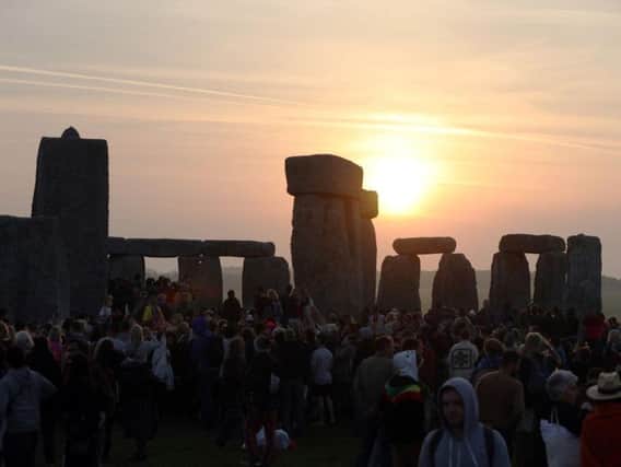Approximately 13,000 people descended on the neolithic monument in Wiltshire to watch the sun rise at 4.52am - up from 12,000 last year.