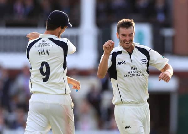 Middlesex's Toby Roland-Jones (right) celebrates with Steven Finn (left) (Photo: PA)