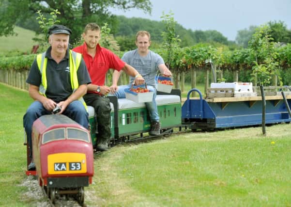 Karl Avison driving the model train with staff Richard Hindby (centre ) and Gordon O'Connor at the Cedar Barn near Pickering. Pictures by Gary Longbottom.