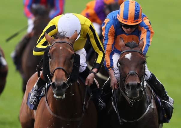 Big Orange ridden by jockey James Doyle (left) battles with Order Of St George ridden by Ryan Moore on the way to winning the Gold Cup during day three of Royal Ascot.