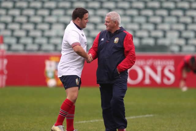 British and Irish Lions head coach Warren Gatland with Jamie George during Thursday's training session at the QBE Stadium. Picture: David Davies/PA.