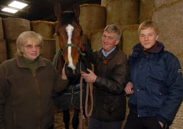 family matters: Mary Reveley, left, pictured in 2009 with National contender Rambling Minster, her son Keith and grandson James.