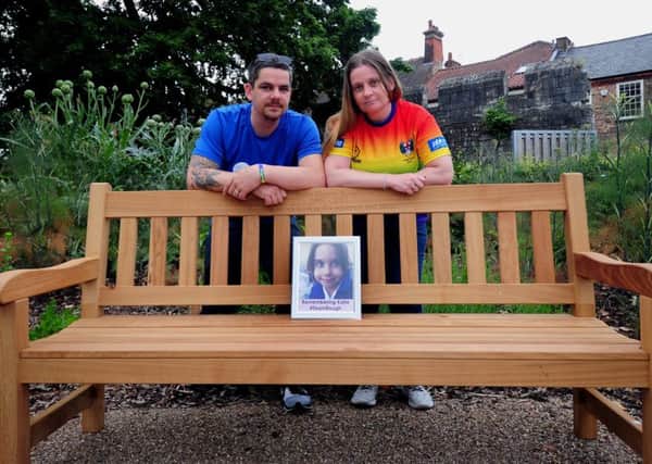 TRIBUTE: Parents Paul and Alison Rough with the bench commemorating their daughter, Katie. PIC: Simon Hulme