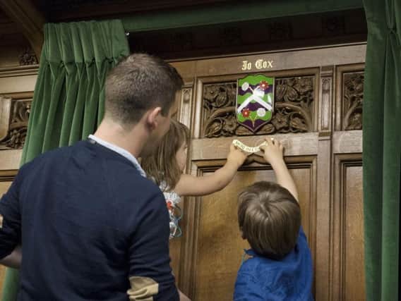 A coat of arms being unveiled in Parliament in honour of murdered MP Jo Cox, by her two children Cuillin, six, and Lejla, four. PRESS ASSOCIATION