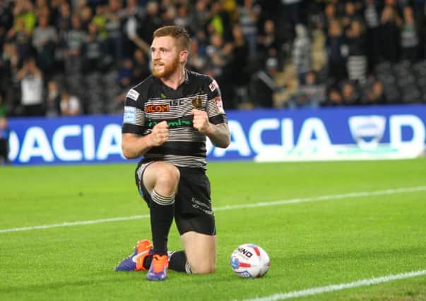 I'm back: Marc Sneyd celebrates his return with a try to put Hull FC ahead.