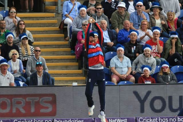 England's Alex Hales catches South Africa's Chris Morris on the boundary during the T20 match at the SSE SWALEC. Picture: Nigel French/PA
