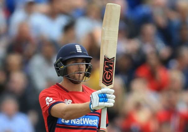 England's Dawid Malan raises his bat after reaching his half century. Picture: Nigel French/PA