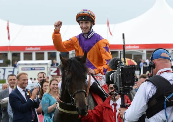 Winner: Harbour Law and George Baker after winning the St Leger.