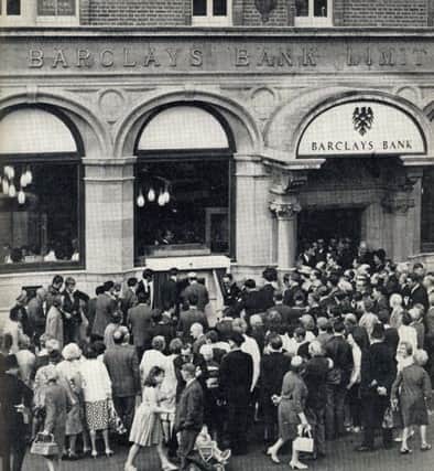 Actor Reg Varney at the official opening of the world's first ATM, at Barclays in Enfield, London on 27th June 1967.