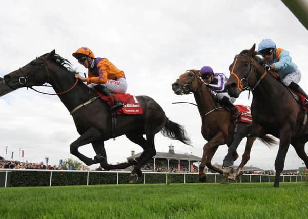 Harbour Law ridden by George Baker (left) beats Ventura Storm ridden by Silvestre De Sousa (right) to win the St Leger Stakes at Doncaster racecourse last September. Picture: Anna Gowthorpe/PA