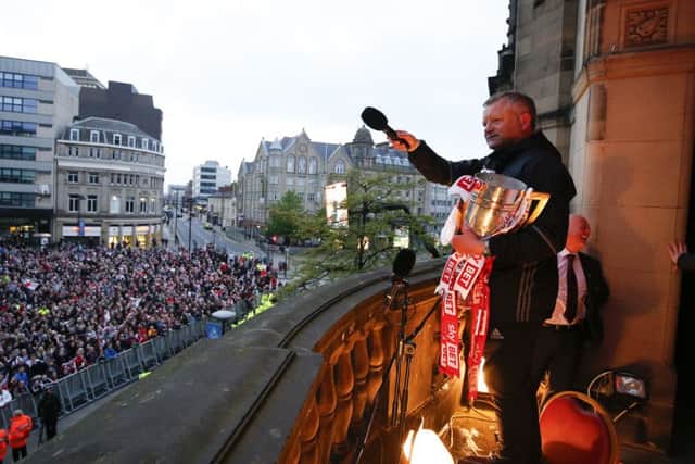 Chris Wilder manager of Sheffield United celebrated with the club's fans following an open-top bus parade around the city. Picture: Simon Bellis/Sportimage