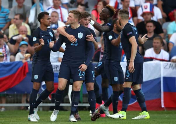 England's Alfie Mawson celebrates scoring his side's first goal of the game during the UEFA European Under-21 Championship, Group A match. Picture: Nick Potts/PA