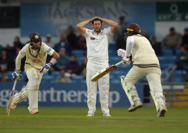 Yorkshire's Tim Bresnan holds his head as Surrey's Tom Curran and Kumar Sangakkara pile on the runs at Headingley,. Picture: Anna Gowthorpe/PA