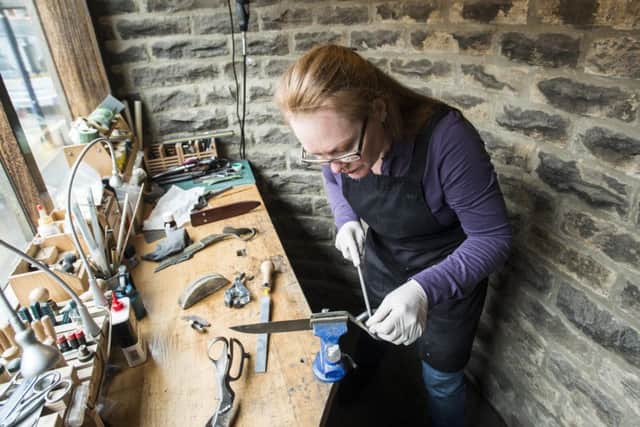 Sheffield knifemaker Grace Horne in her workshop, a former public convenience, in Fulwood