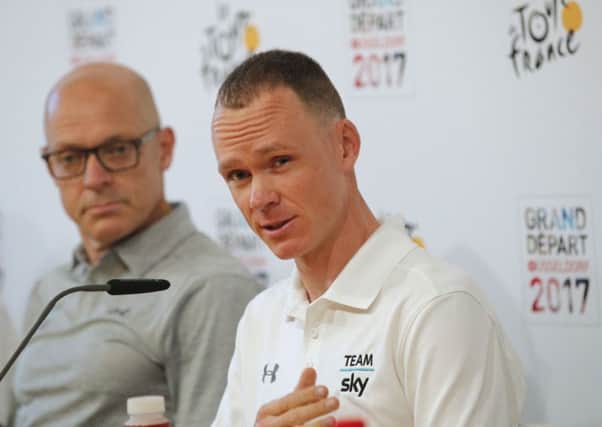 Sky team manager Sir Dave Brailsford, left, and Britain's Chris Froome take questions during a press conference.