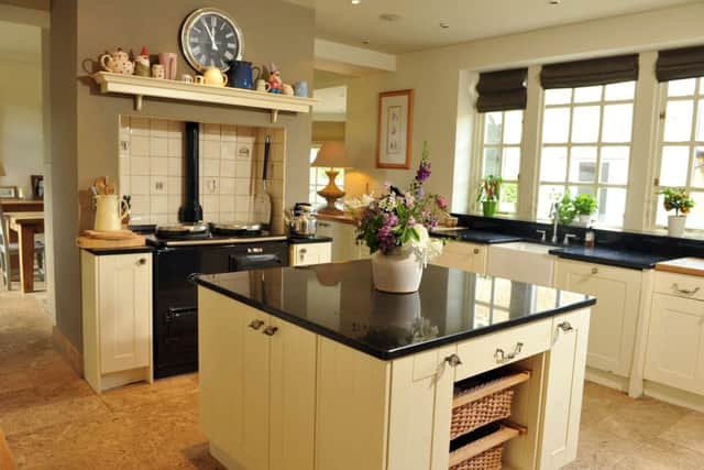 Suzi created a large kitchen/dining area by knocking through a dividing wall. The chimney breast was left, creating the ideal space for the Aga