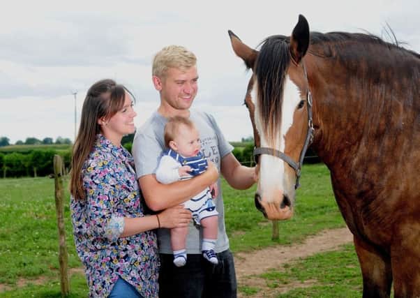 Matthew and Verity Bedford pictured with their son Reggie aged 15 weeks, at Thorpe Hill Farm, Whixley. Picture by Simon Hulme