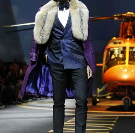 Russian bling - Theres more than a hint of pre-revolutionary opulence meets modern-day swagger, as epitomised by this look blending fur, double-breasted shimmer, purple snakeskin great coat and blue ankle boots. You can take aspects, rather than the whole caboodle. Billionaire men's Fall-Winter 2017-2018 collection, Milan Fashion Week (AP Photo/Antonio Calanni).