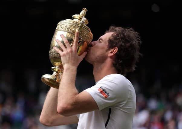SAME AGAIN PLEASE: Andy Murray celebrates winning the Men's Singles Final last year. Picture: PA