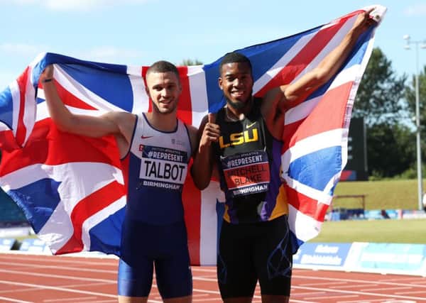 Nethaneel Mitchell-Blake (right) celebrates winning the men's 200 Metres Final alongside second placed Danny Talbot.