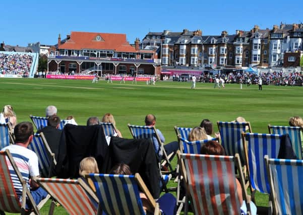 Crowds enjoy the cricket at Scarborough.