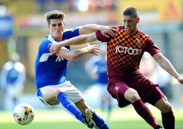 Jamie Proctor, right, in action while at Bradford City in 2015-16. Picture : Jonathan Gawthorpe