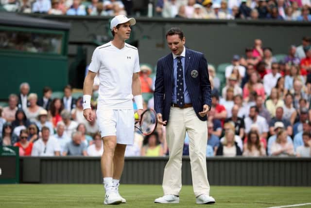 Andy Murray and with match umpire Jake Garner. Picture: Steven Paston/PA