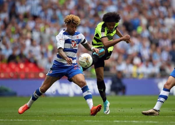 Reading's Daniel Williams attempts to block the shot from Huddersfield Town's Isaiah Brown during the Sky Bet Championship play-off final.