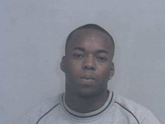 Damien Munroe who is wanted by police.