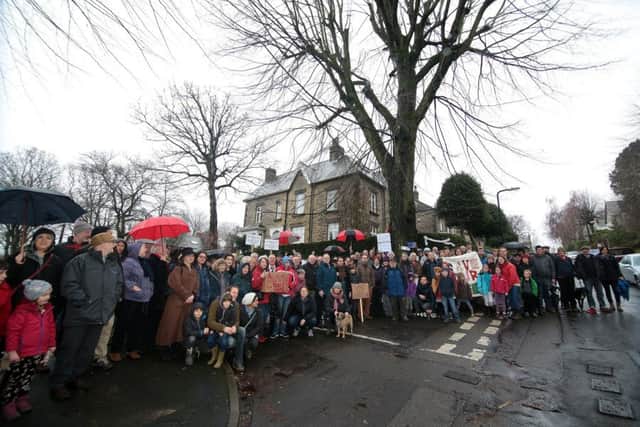 Protesters gather to complain about the planned feling of an elm tree at Nether Edge, Sheffield